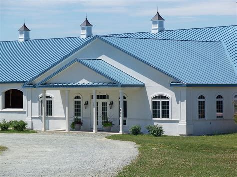 blue house tan metal roof|blue metal roof exterior home.